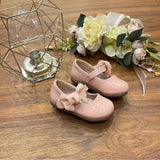 Ballerine in vernice con fiocco
